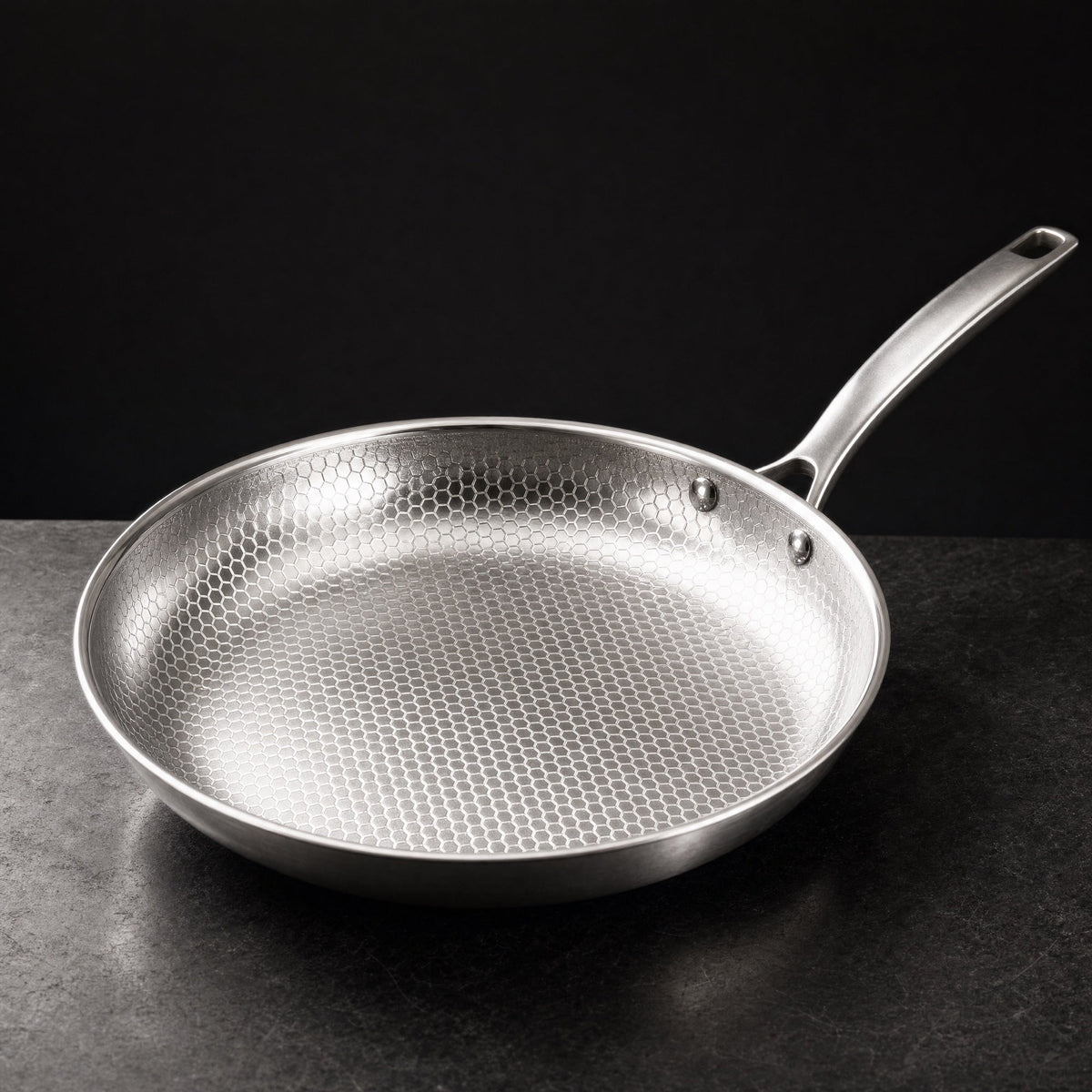 Kitchi Titanium Fry Pan on a dark stone counter